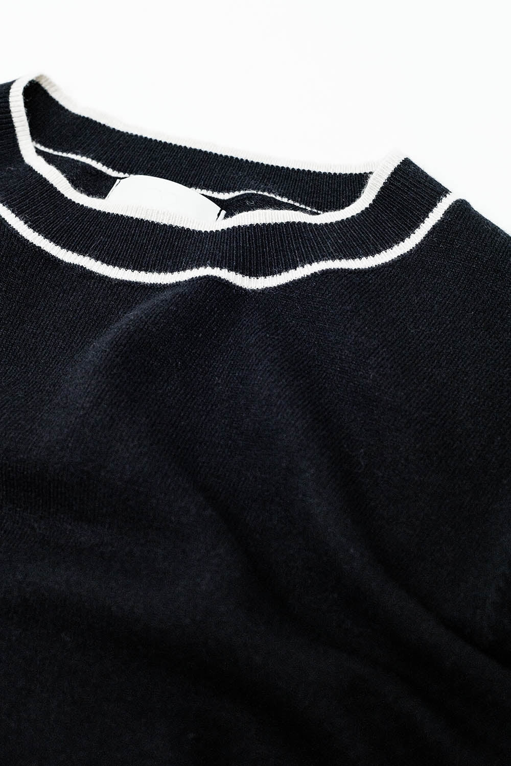 Black short sleeve sweater with white line detail