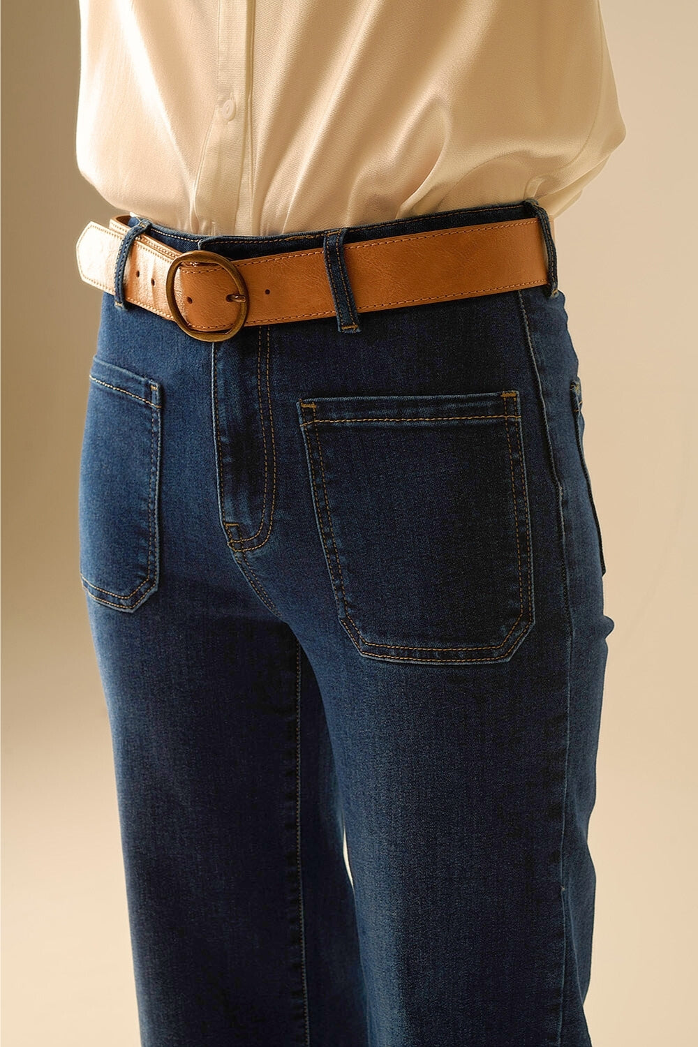 Dark wash jeans with wide leg and pockets