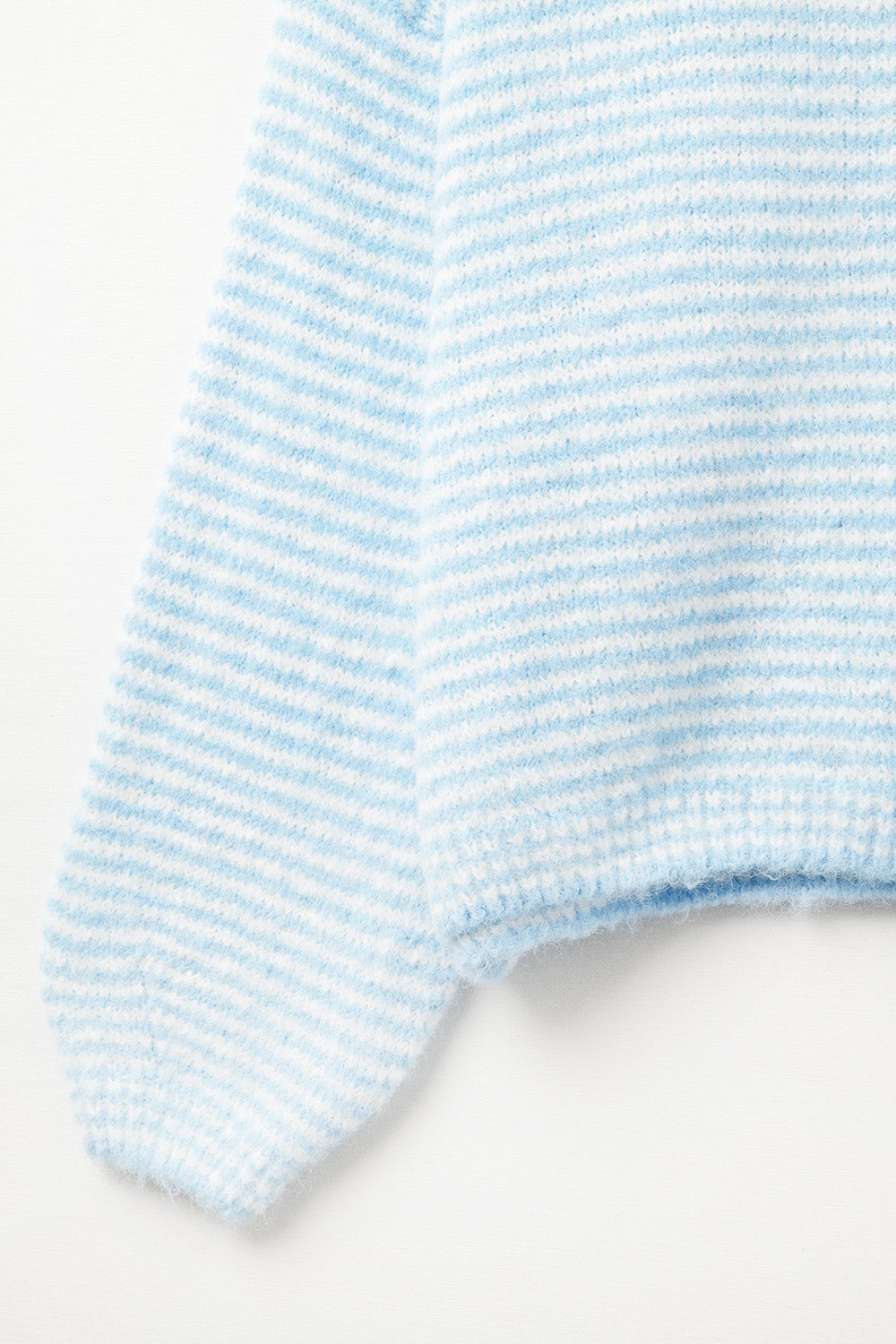Fluffy striped sweater in baby blue