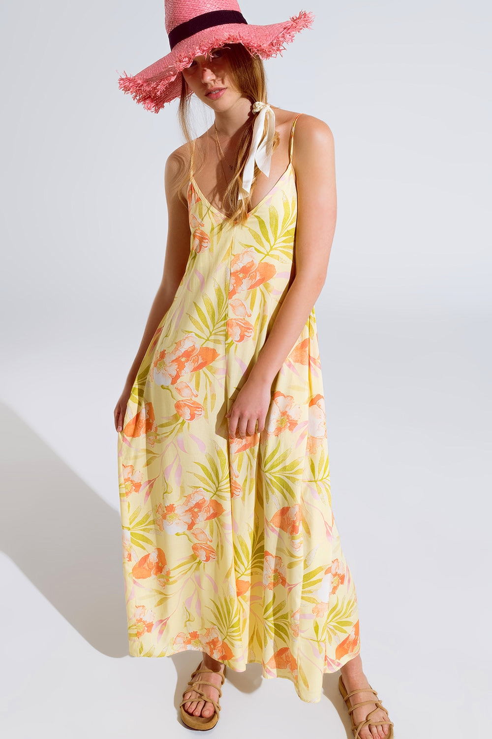 macacão comprido amarelo com estampado tropical