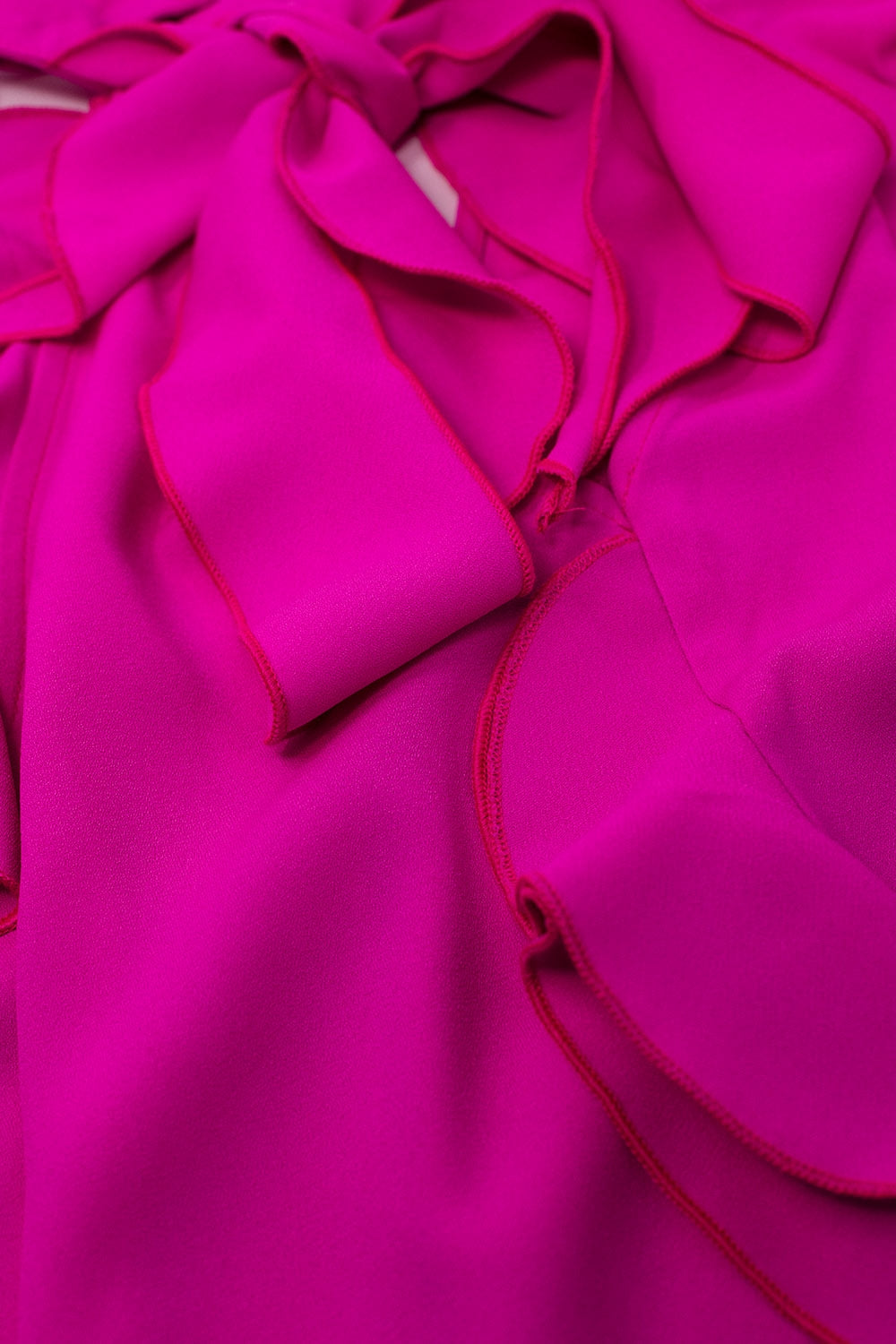 Sleeveless Pink Top with Ruffled Details and High Neck