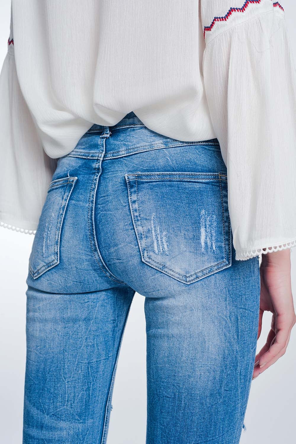 super skinny jeans in vintage mid wash blue with heavy rips