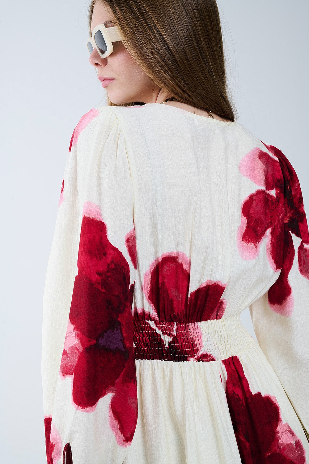 Beige wrap midi dress with red tropical floral print and long sleeves
