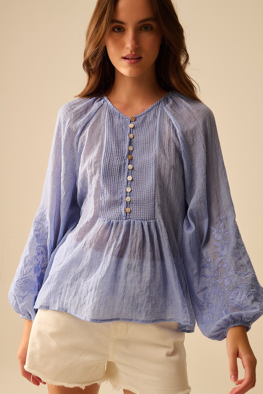 Q2 Blue chiffon blouse with embroidery on the sleeves