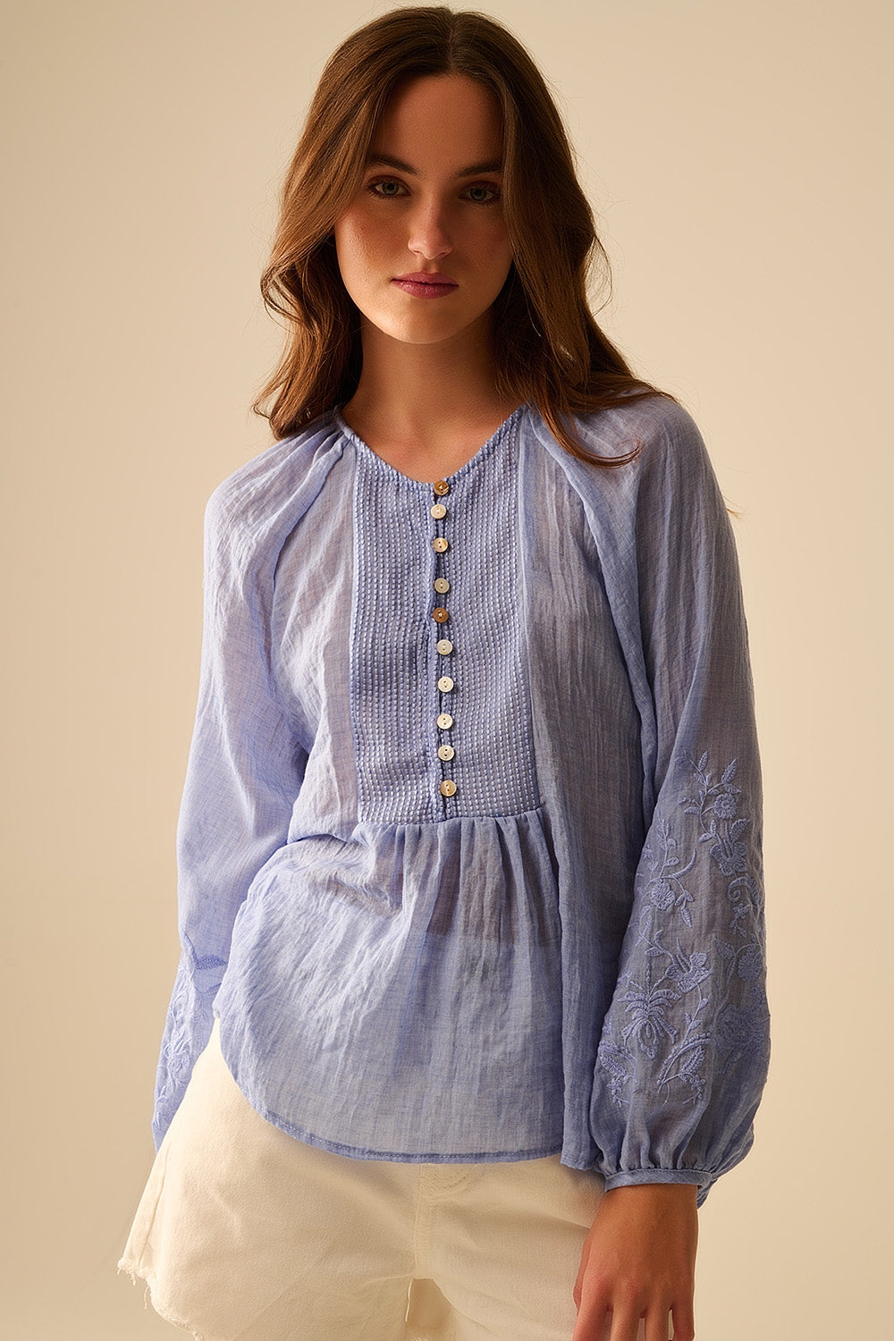 Blue chiffon blouse with embroidery on the sleeves