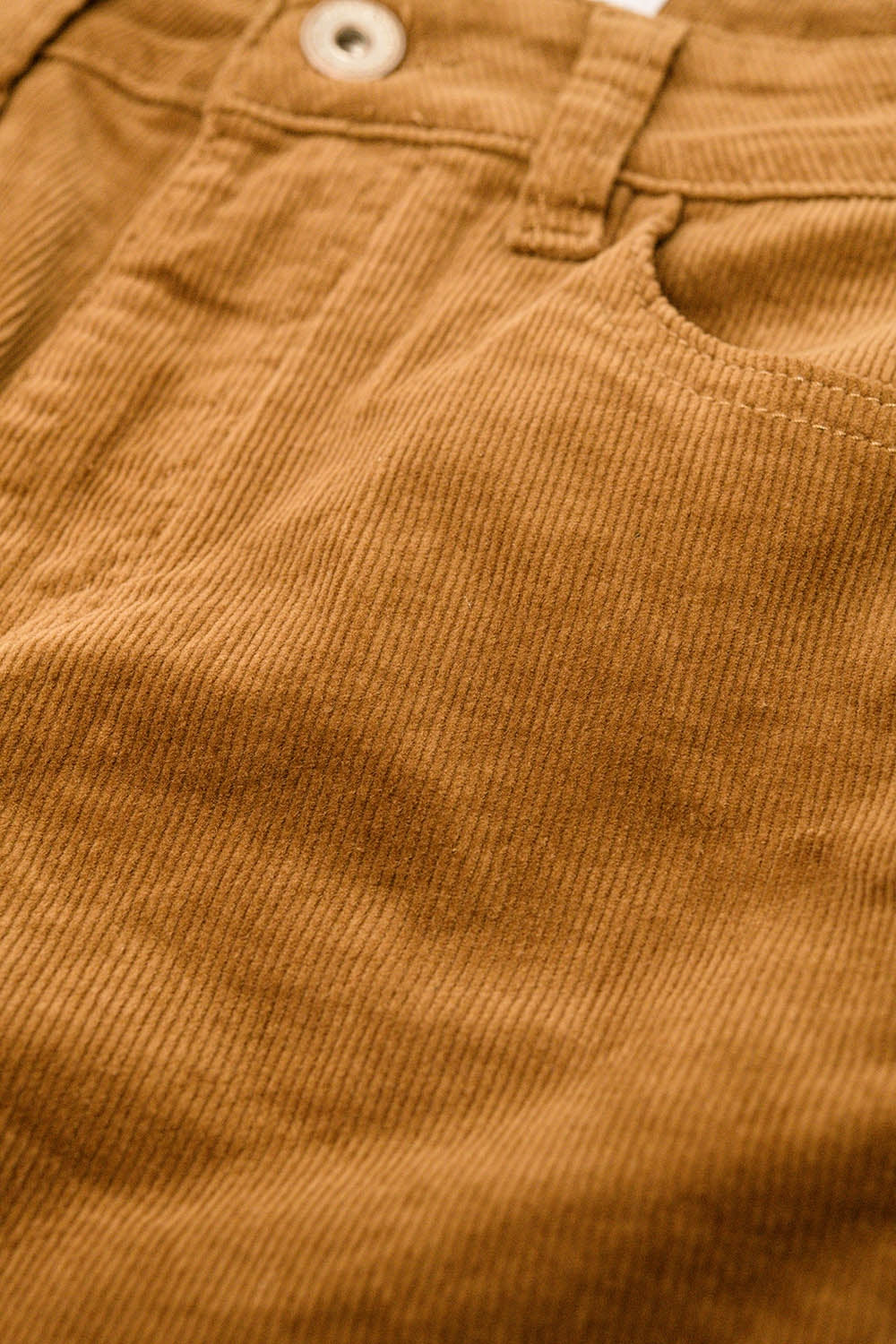 Brown corduroy flare pants with leopard print at the bottom