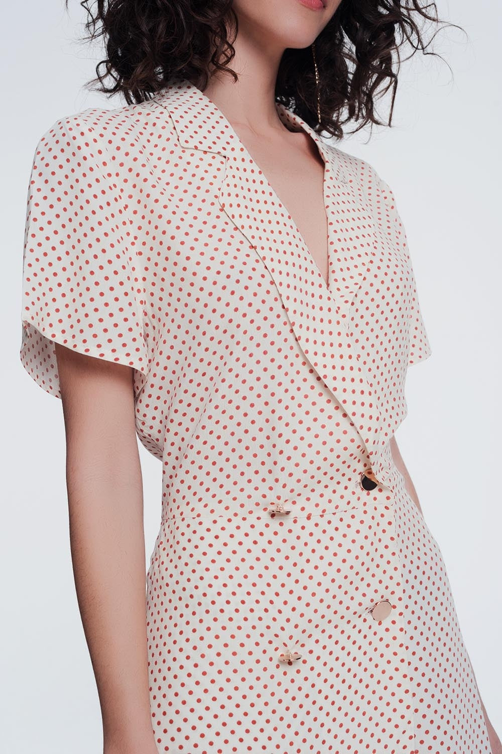 jumpsuit met knoopjes aan de voorkant in beige