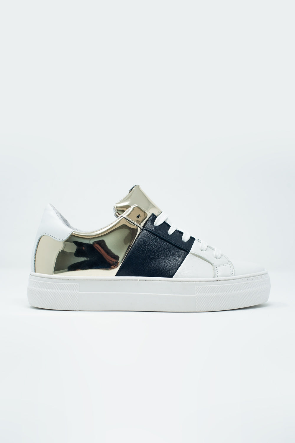 Dikke sneakers in zwart en goud