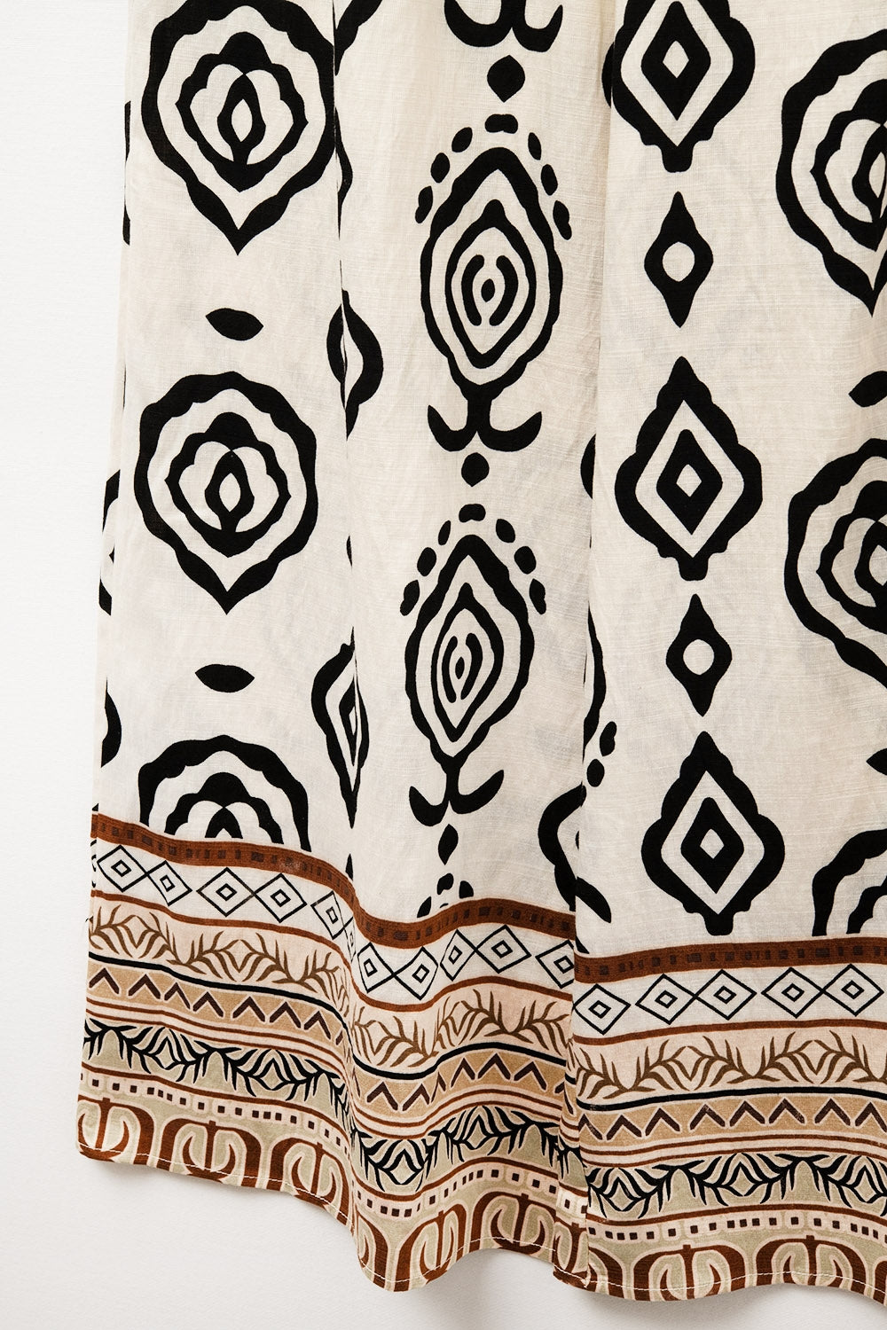 Calças largas creme com estampado boho