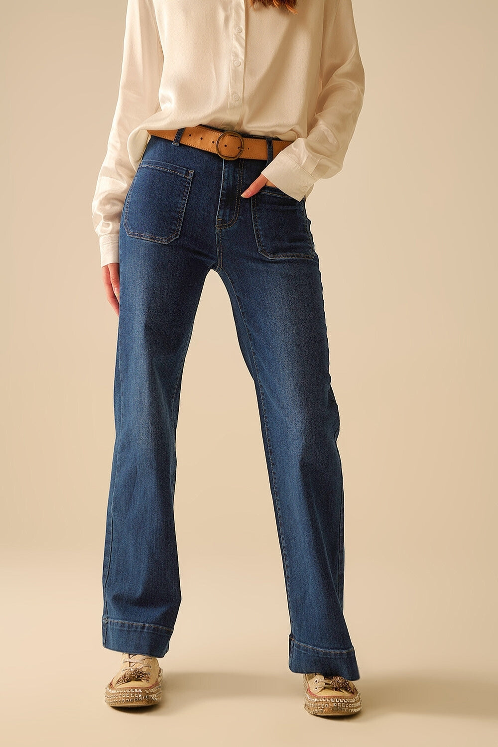Dark wash jeans with wide leg and pockets