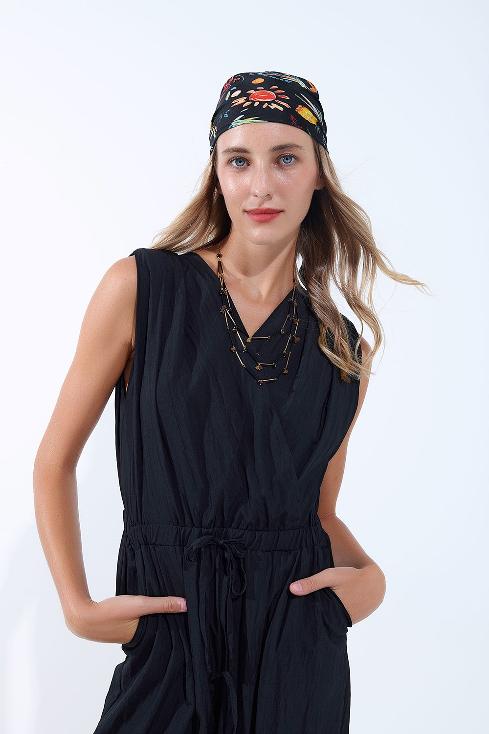 draped black jumpsuit in crinkled fabric