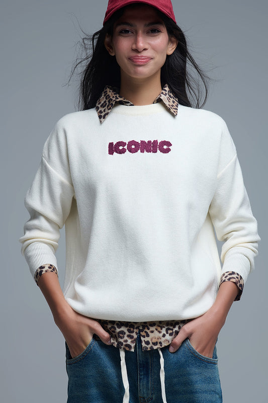Q2 Embroidered ICONIC Sweater with Global Tour Back Print in Cream