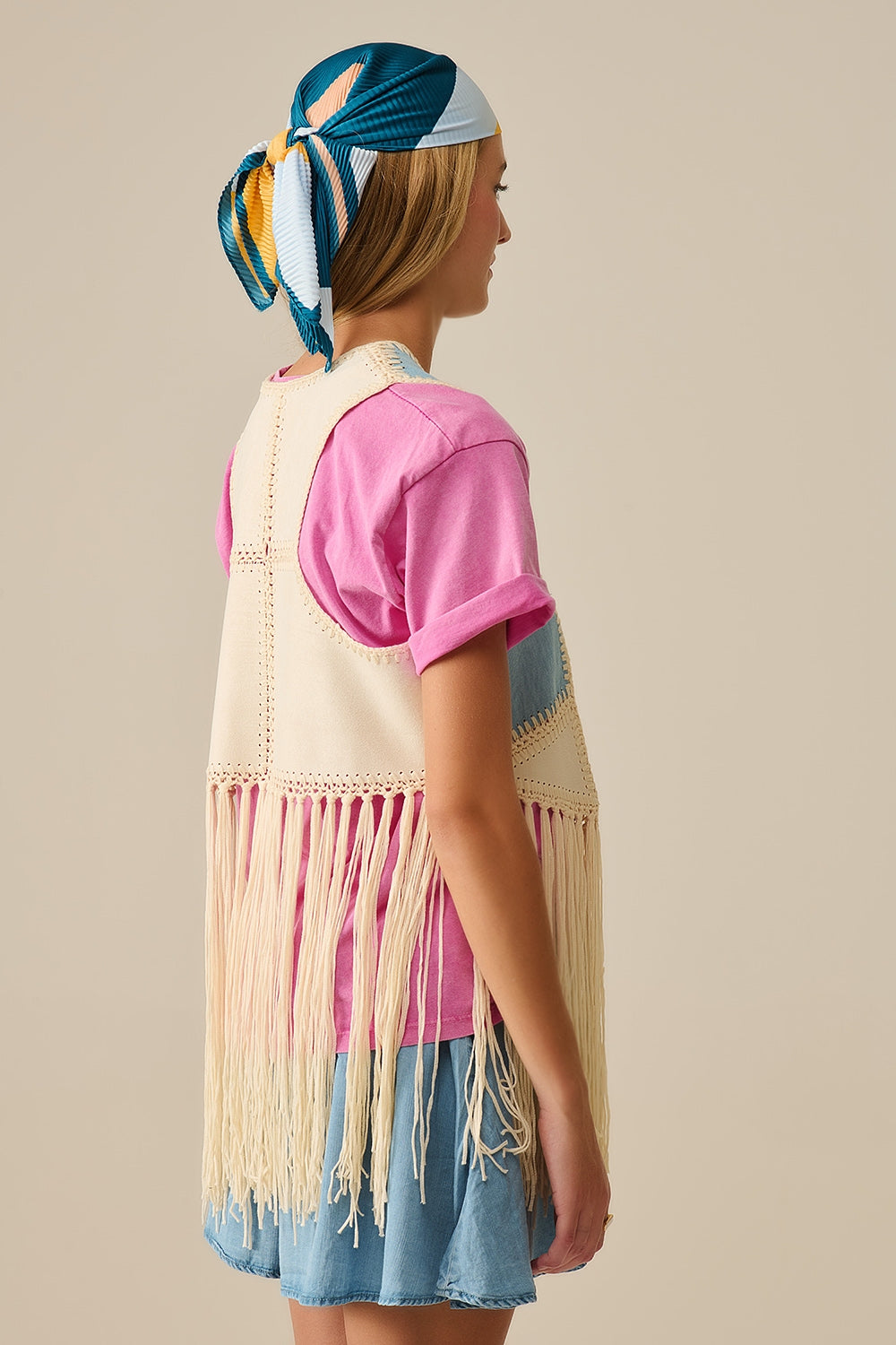 Faux leather vest with patchwork and fringe detail