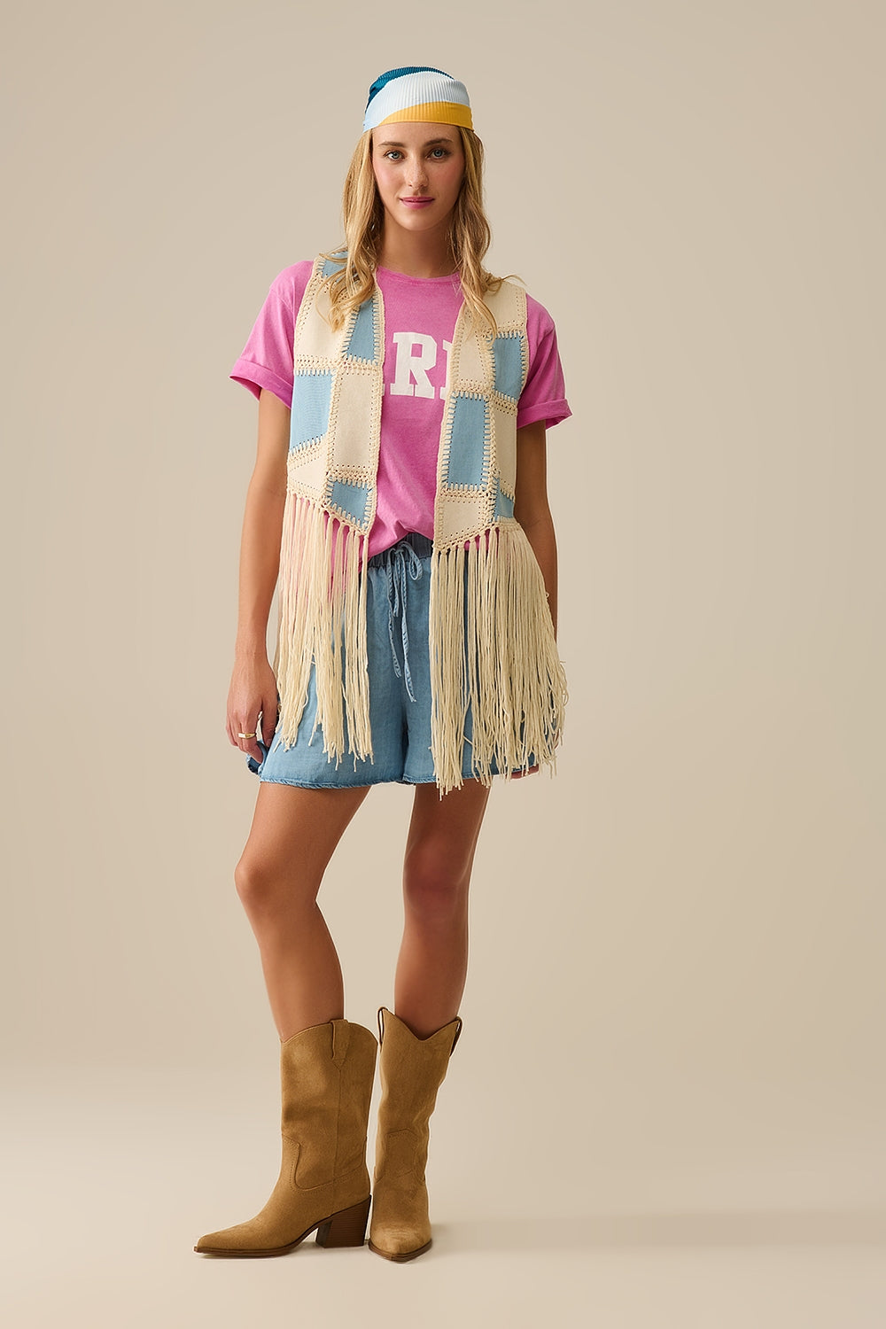 Faux leather vest with patchwork and fringe detail