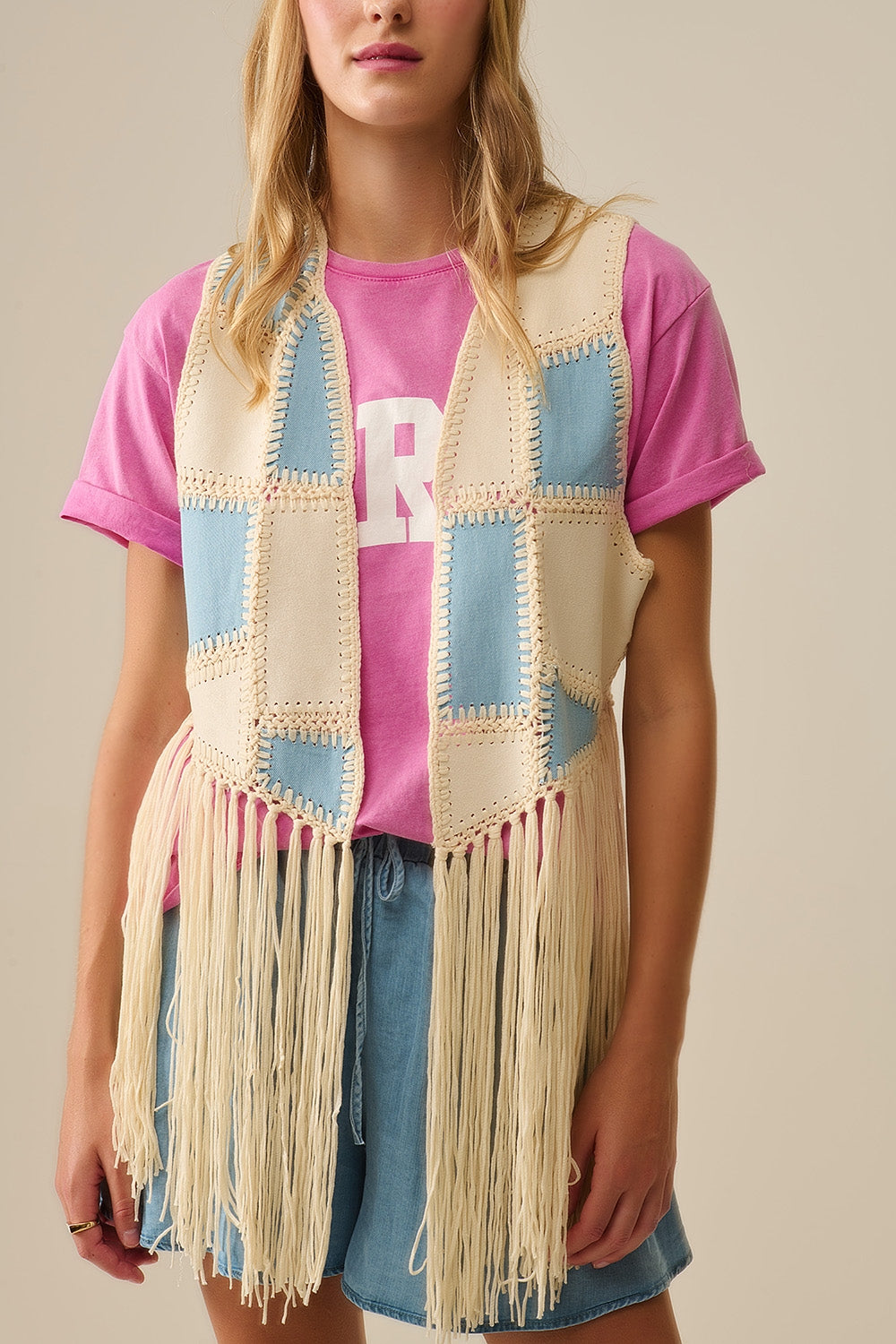 Faux leather vest with patchwork and fringe detail
