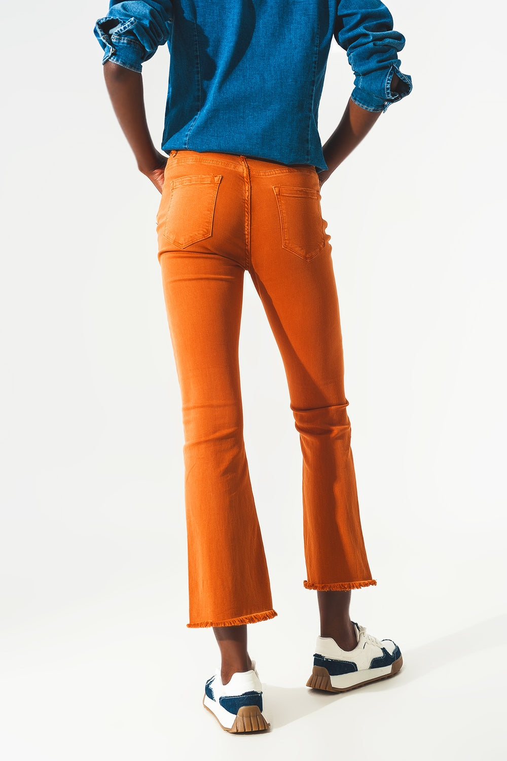 Flare jeans with raw hem edge in orange