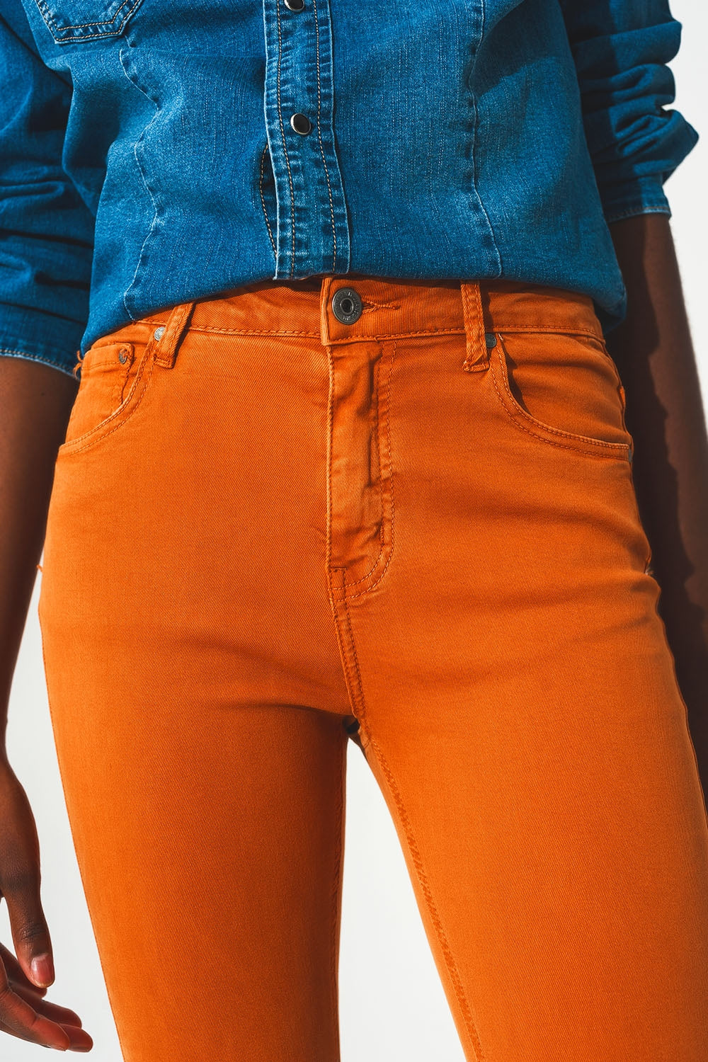 Flare jeans with raw hem edge in orange