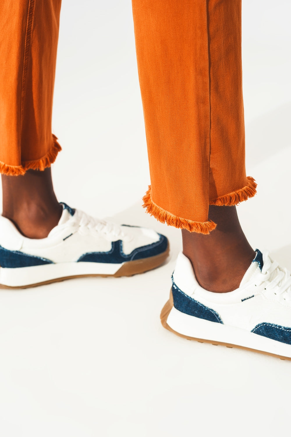 Flare jeans with raw hem edge in orange