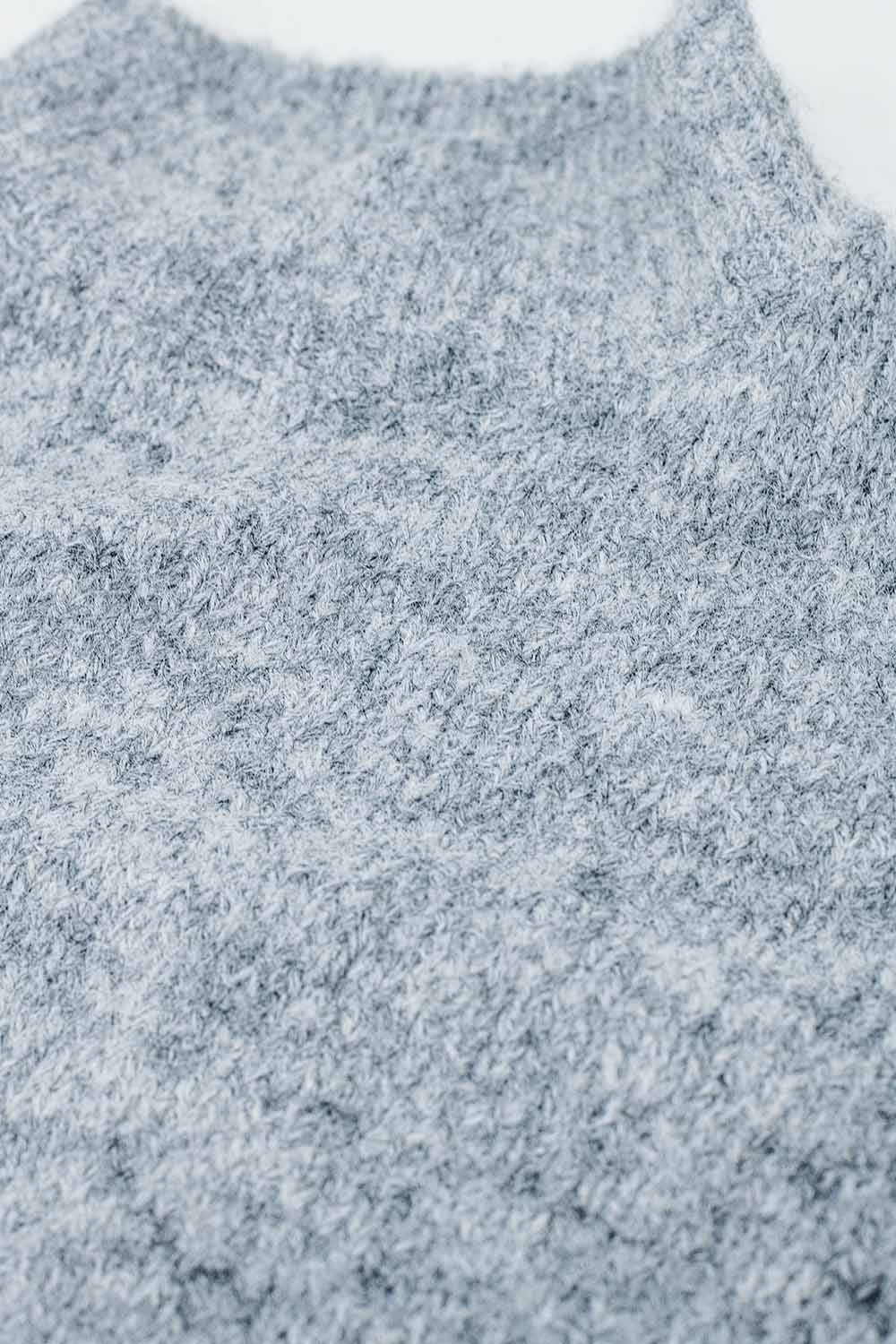 Zachte grijze trui met hoge hals en ballonmouwen