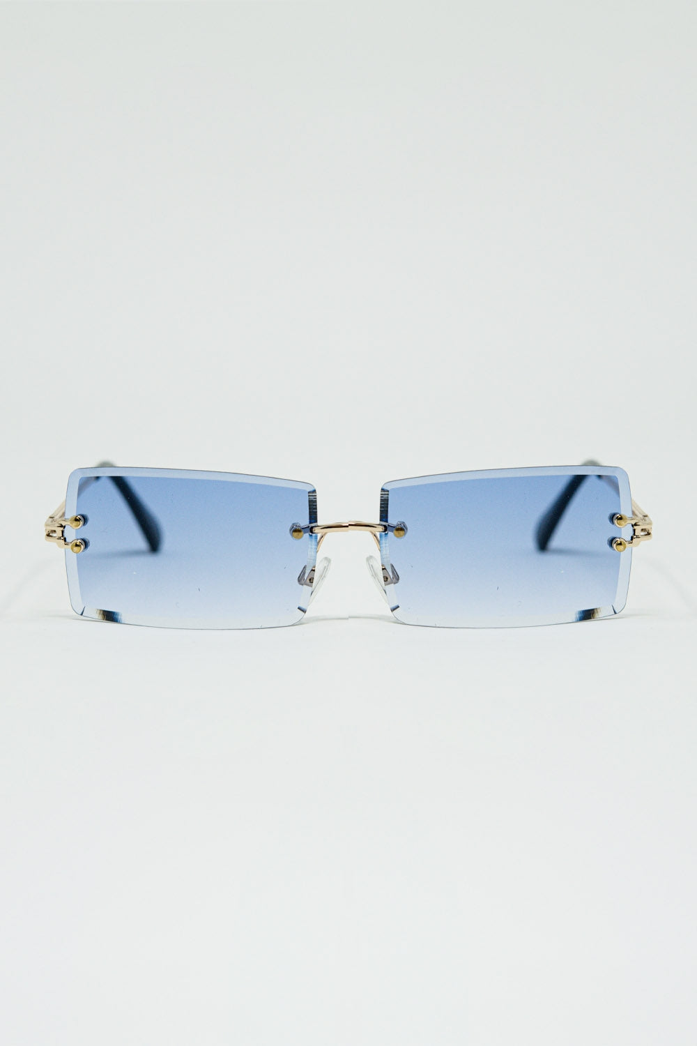 Gouden, dunne, randloze vierkante zonnebril met paarse lenzen