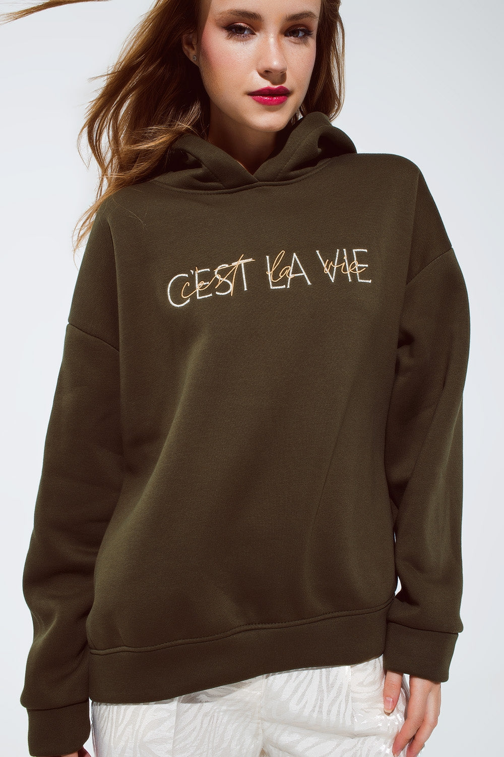 Khaki color hoodie with embroidered Cest La Vie text