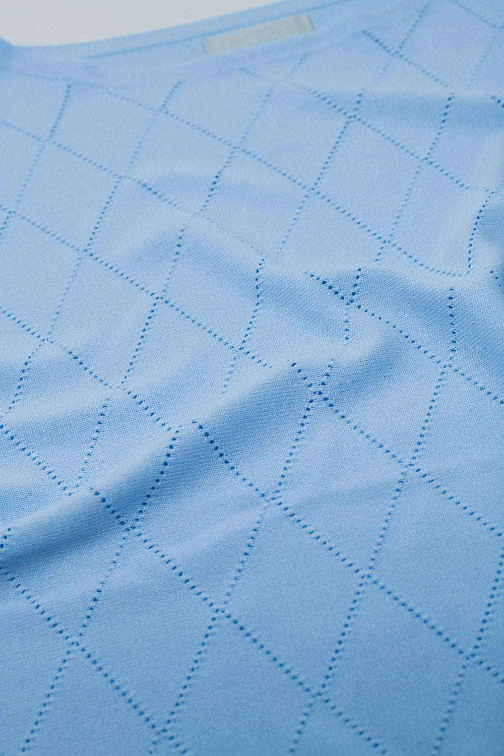 Light blue sweater in argyle print with boat neck