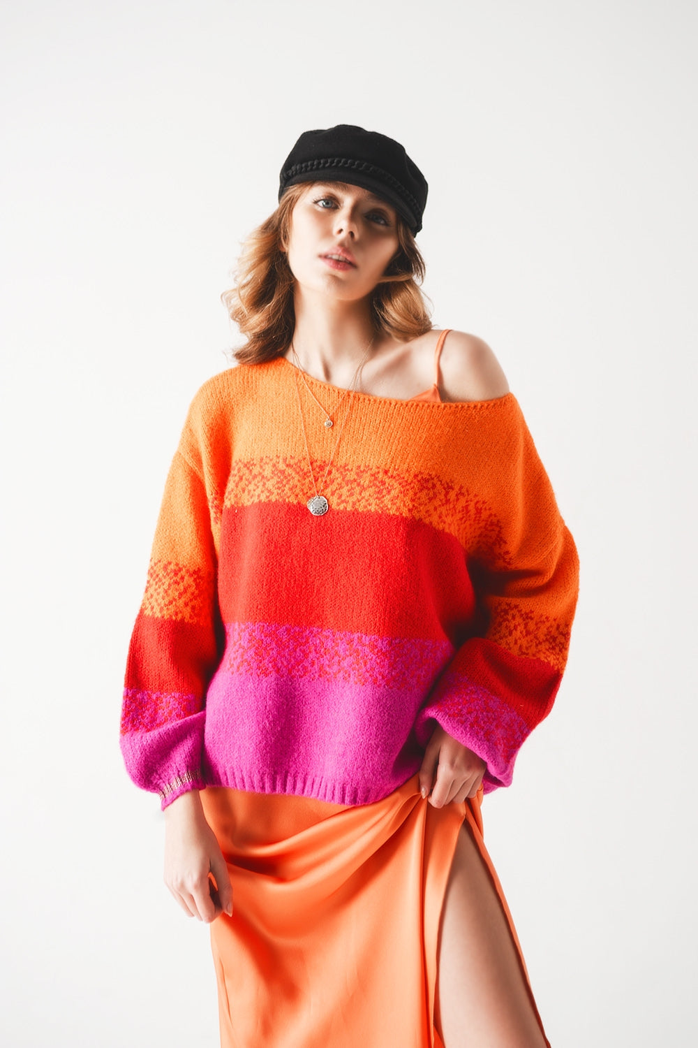 Orange knitted sweater with mélange stripes