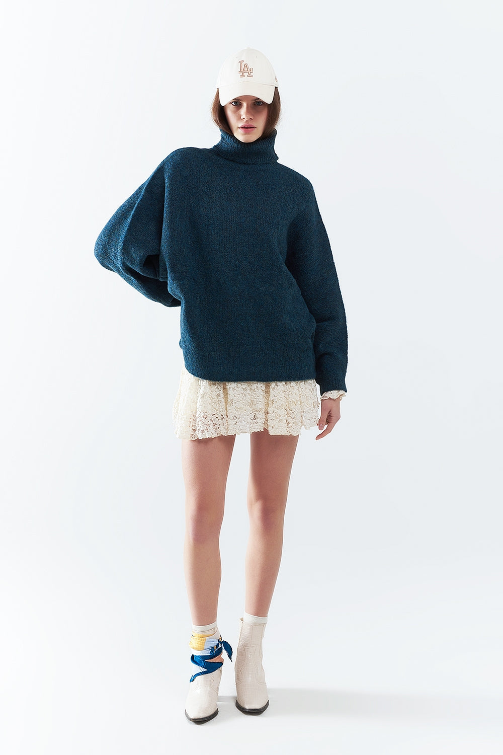 Oversized sweater in teal with a high neck and loose sleeves