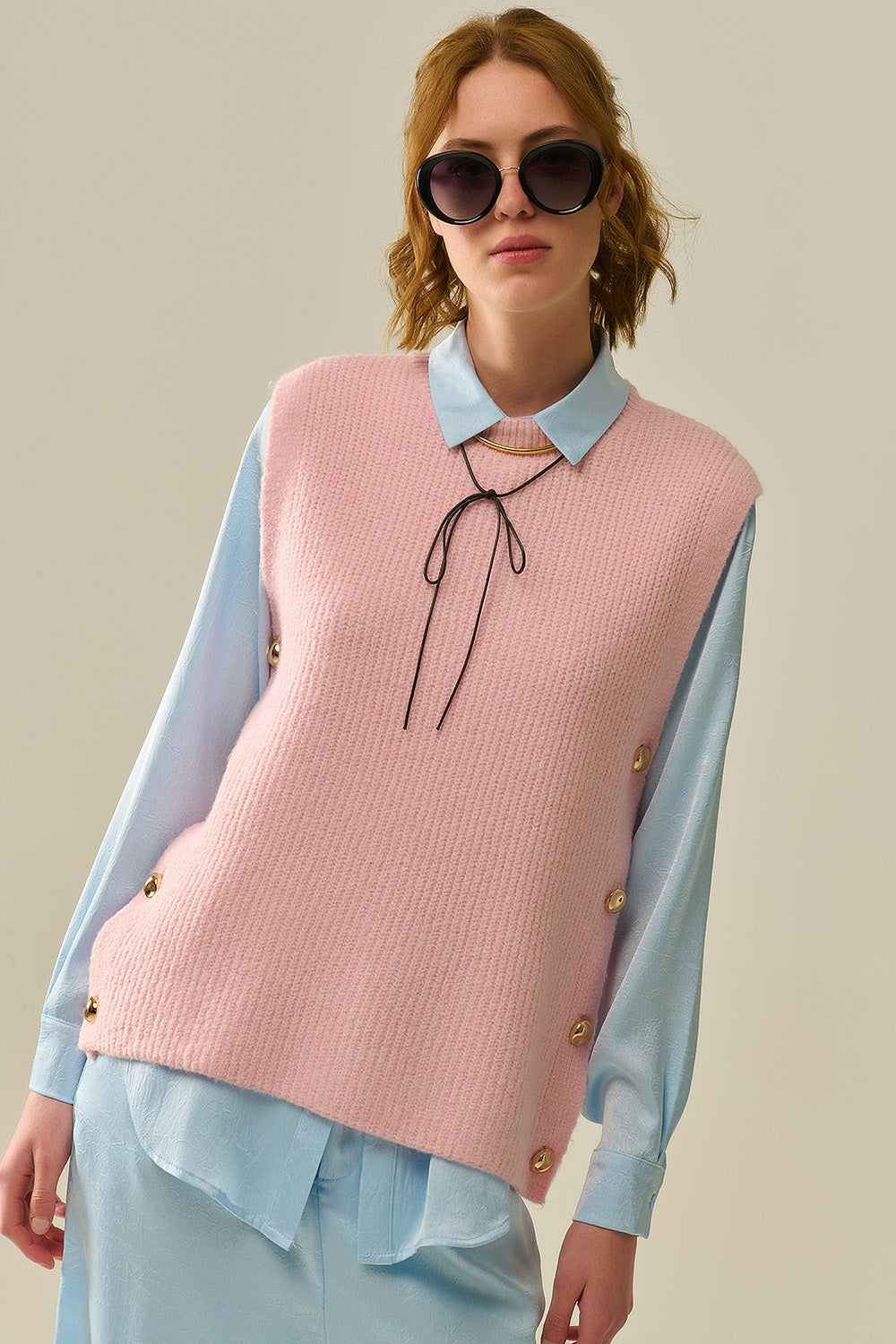 Q2 Pink sleeveless sweater with gold buttons