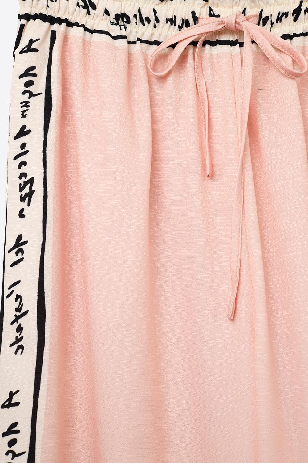 Calças estampadas em aguarela rosa de verão