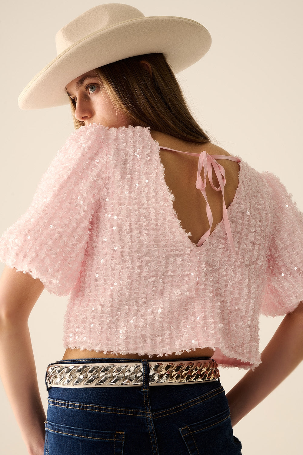 Pink top with sequin detail and balloon sleeves