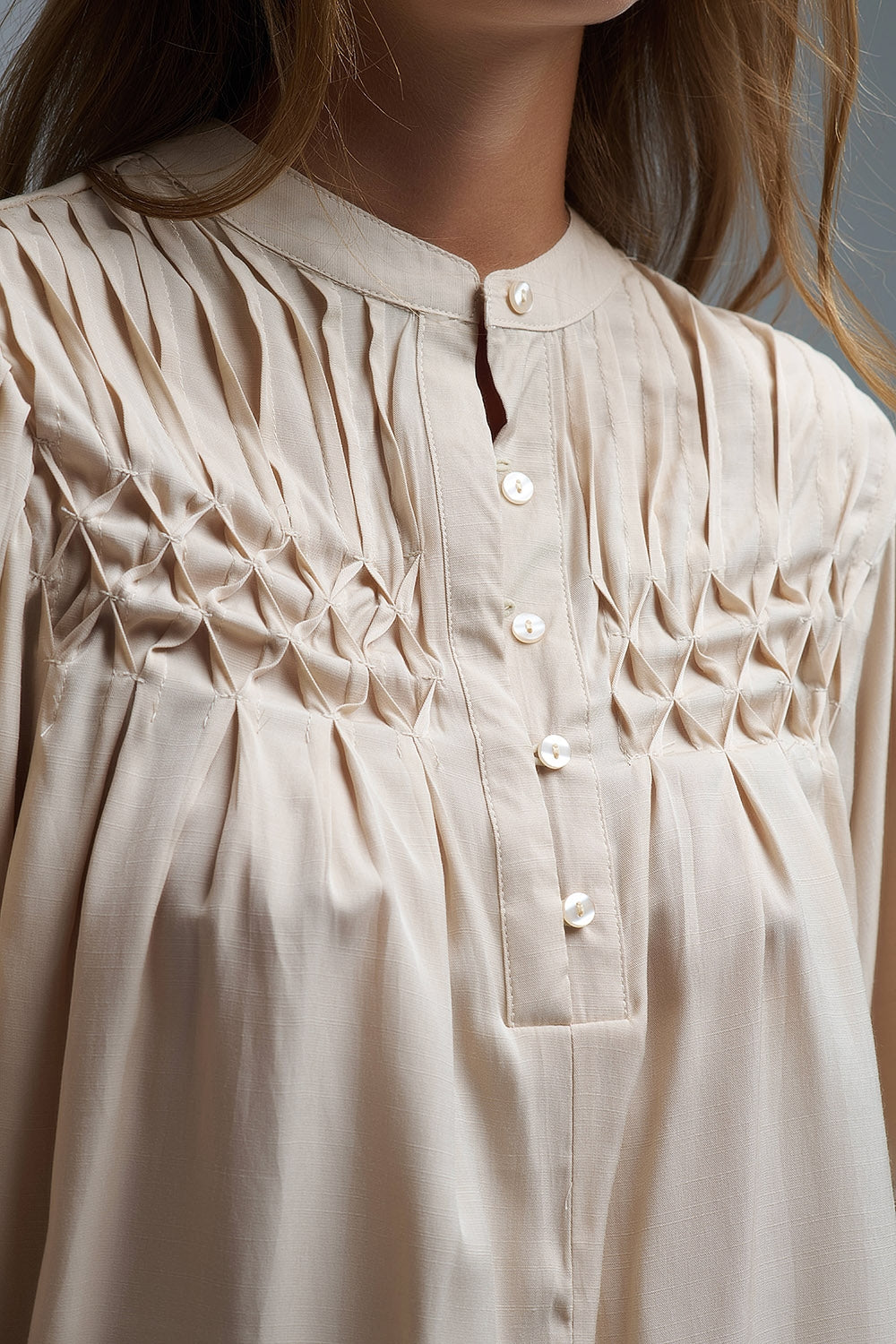 Relaxed Beige boho-style blouse with embroidered details