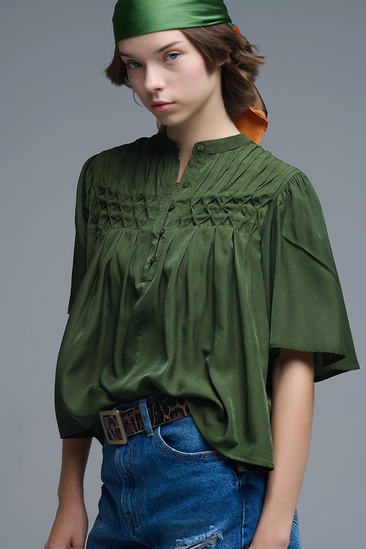 Q2 Relaxed Green boho-style blouse with embroidered details