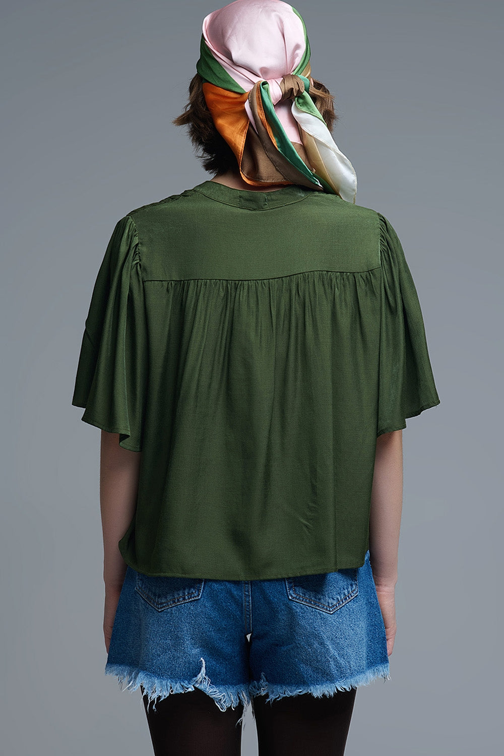Relaxed Green boho-style blouse with embroidered details