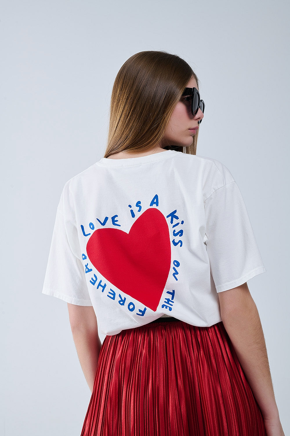 Relaxed white T-shirt featuring a heart design on both the front and back