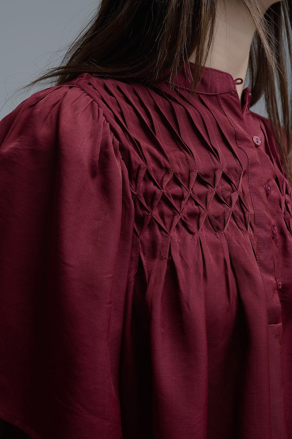 Relaxed wine-colored boho-style blouse with embroidered details