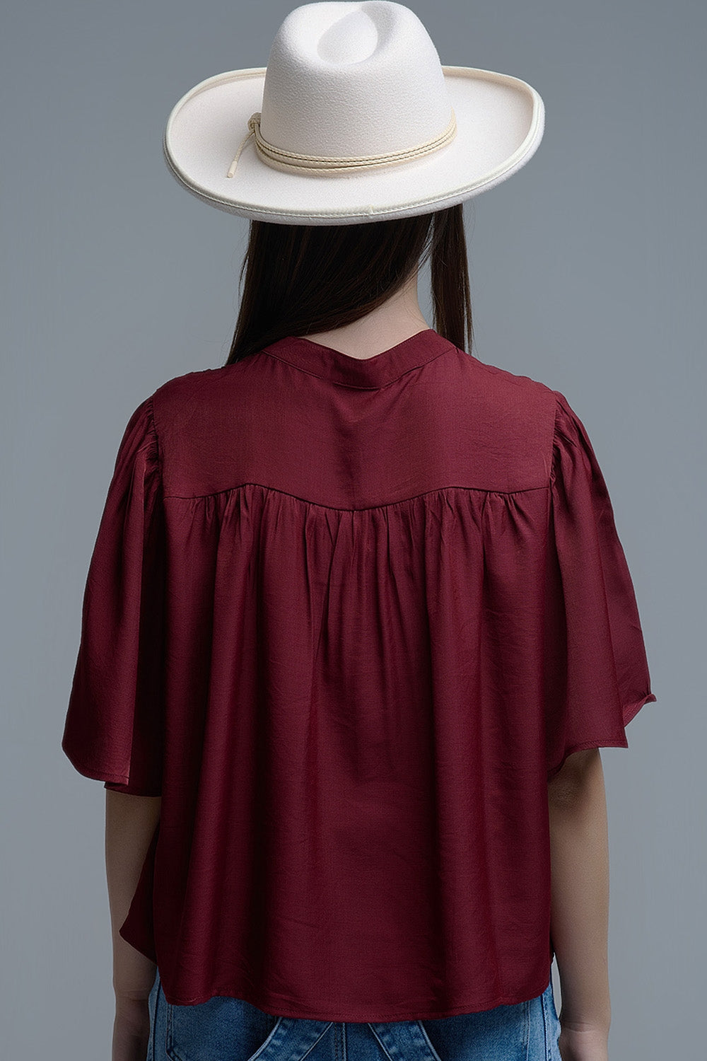 Relaxed wine-colored boho-style blouse with embroidered details