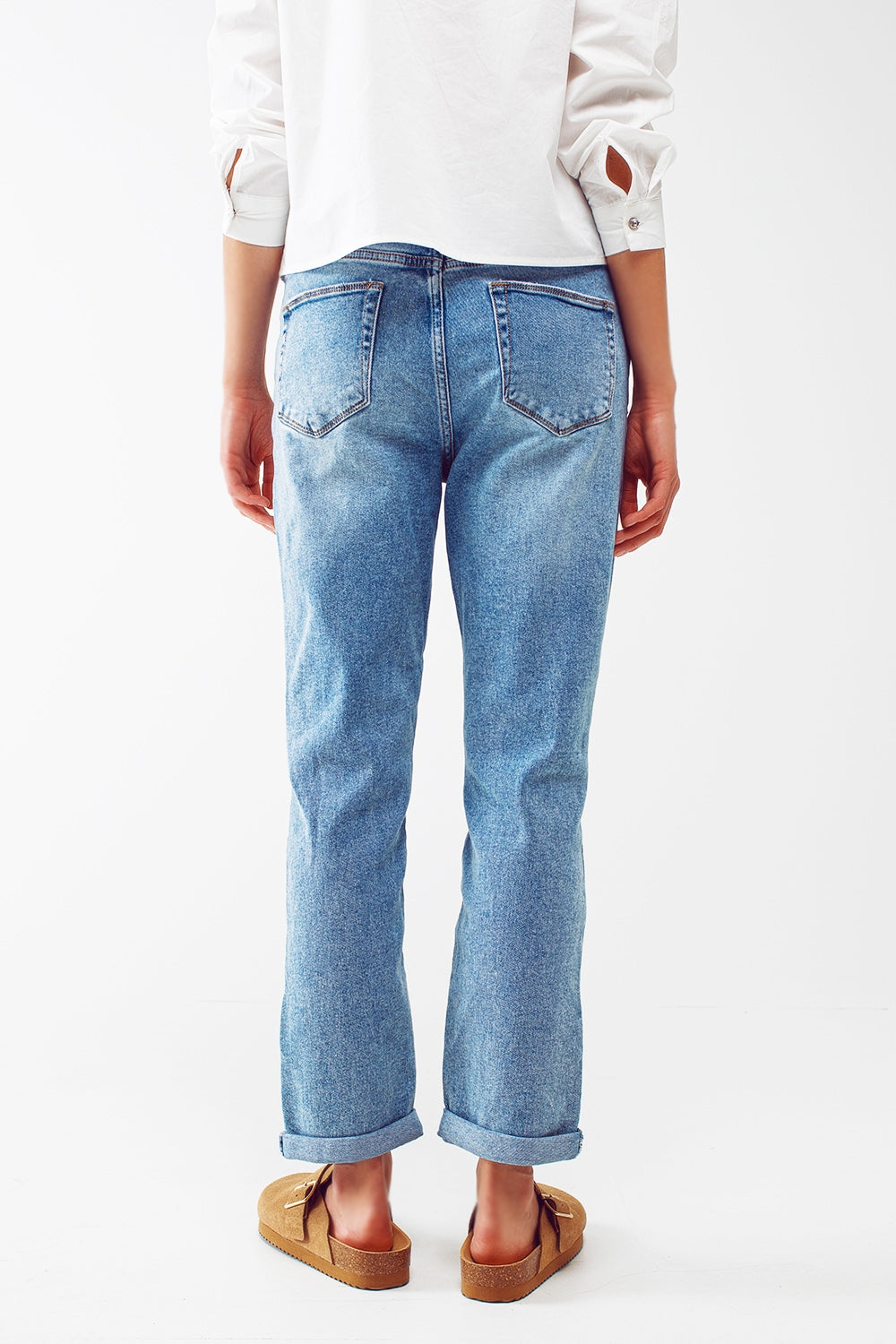 Ripped knee straight leg jeans in light blue wash