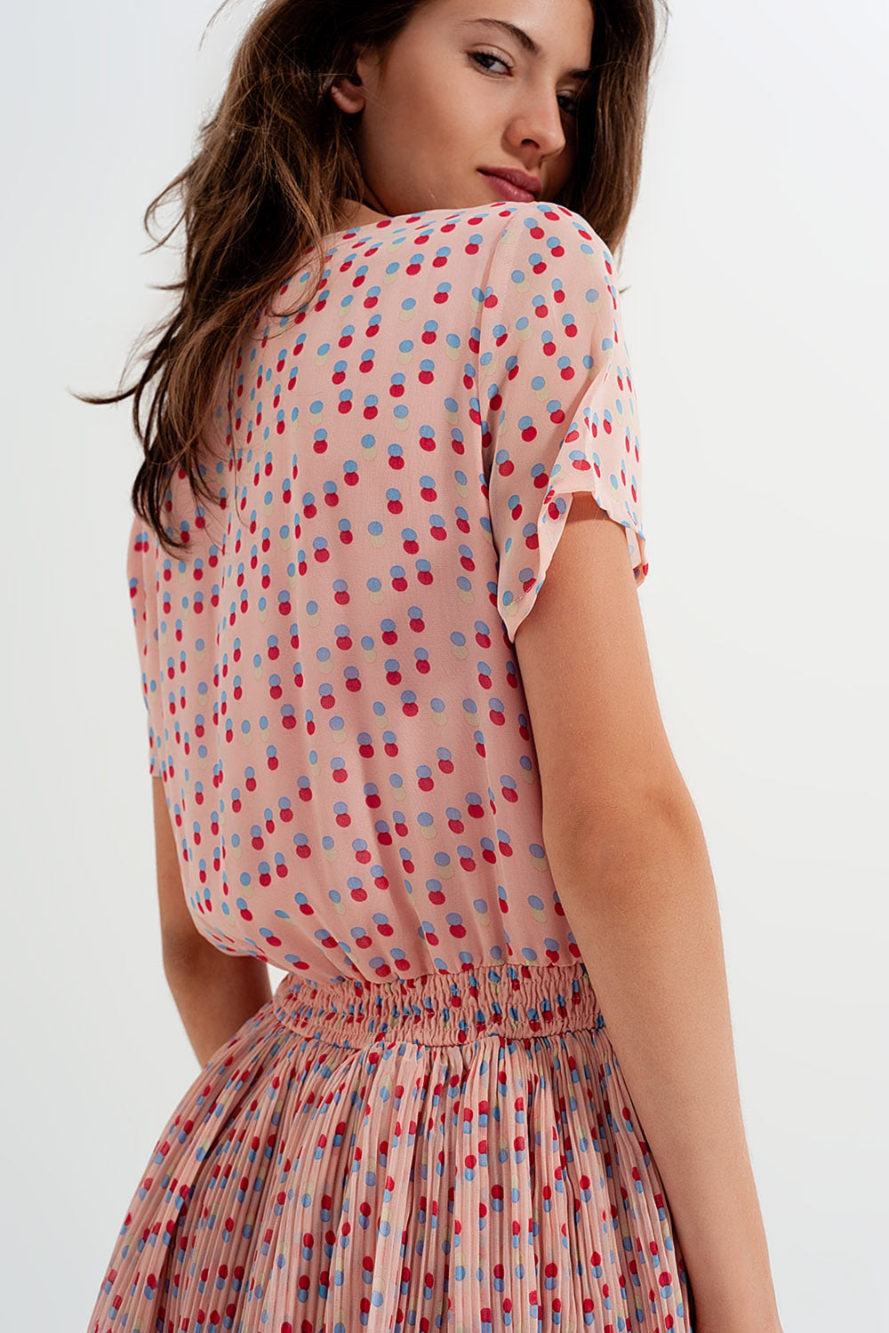 Geplooide mini-jurk met peplum in roze