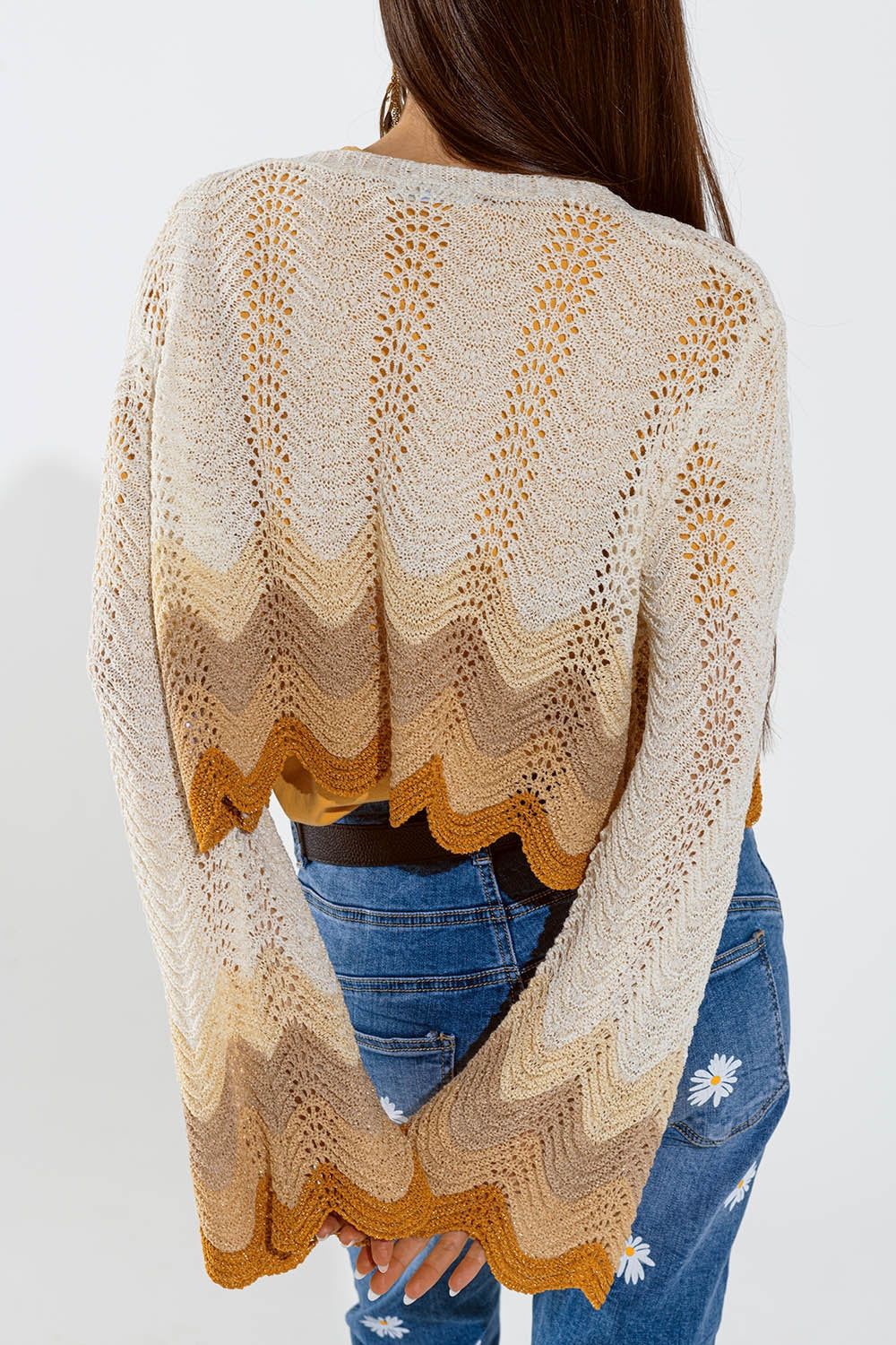 Short knitted cardigan with angel sleeves and wave multicolor detail in beige