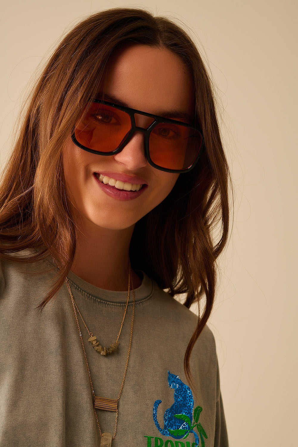 Q2 Sunglasses with black frames and orange lenses