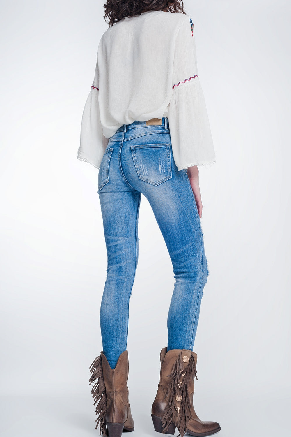super skinny jeans in vintage mid wash blue with heavy rips