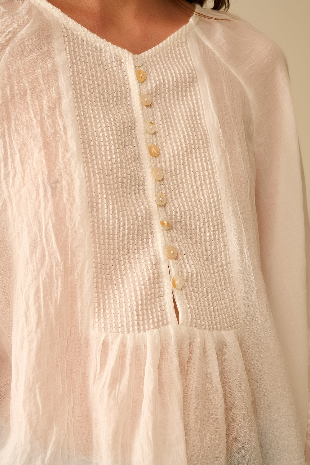 white chiffon blouse with embroidery on the sleeves