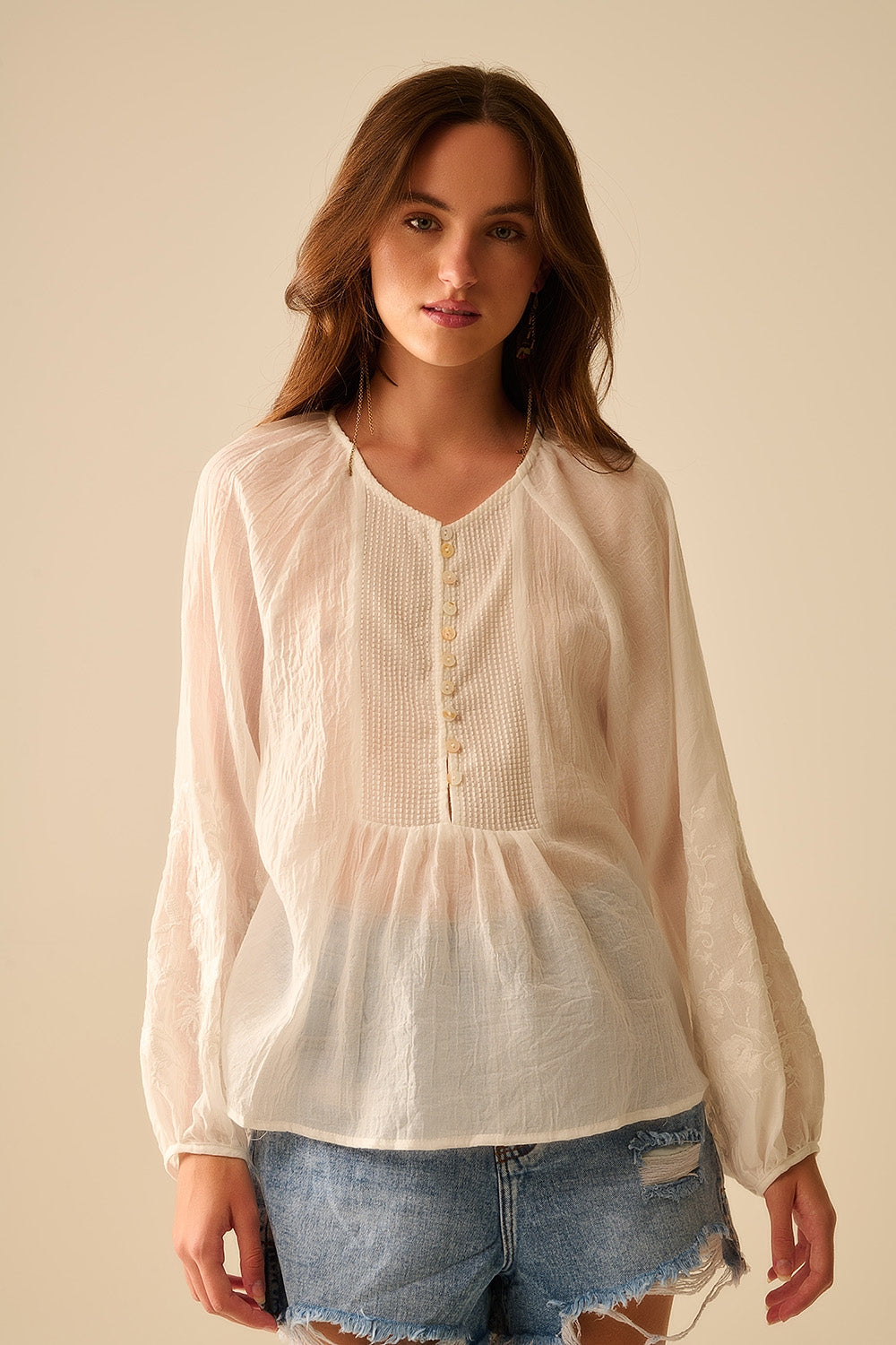 white chiffon blouse with embroidery on the sleeves