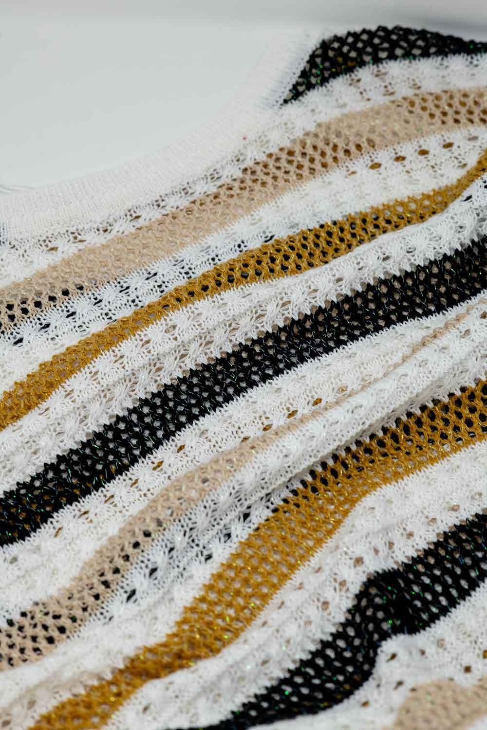 White knit sweater with multicolored stripes