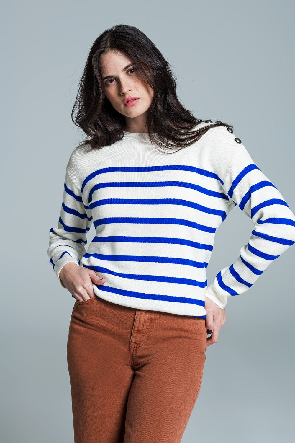 White sweater with buttons on shoulders and blue stripes