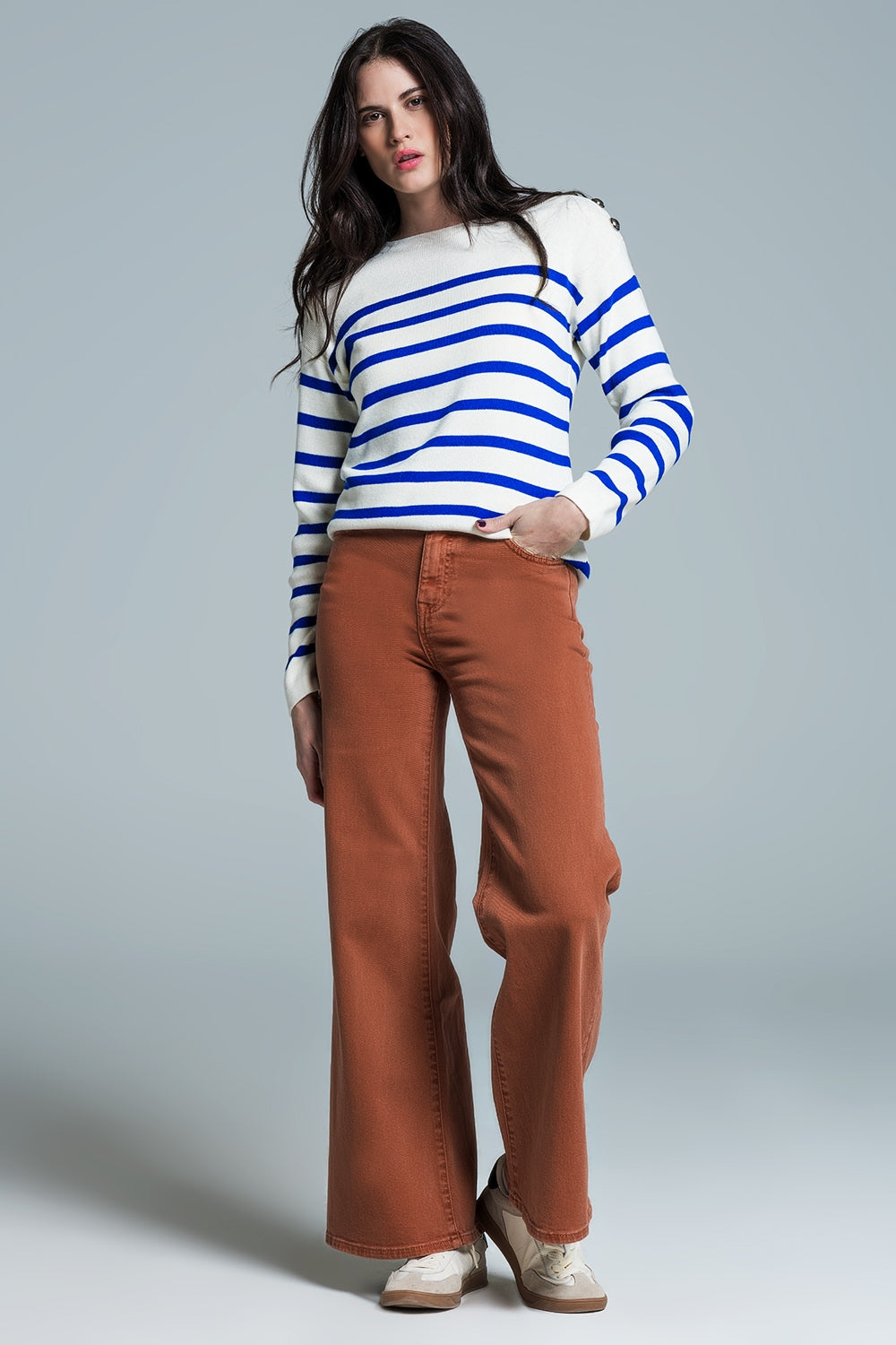 White sweater with buttons on shoulders and blue stripes